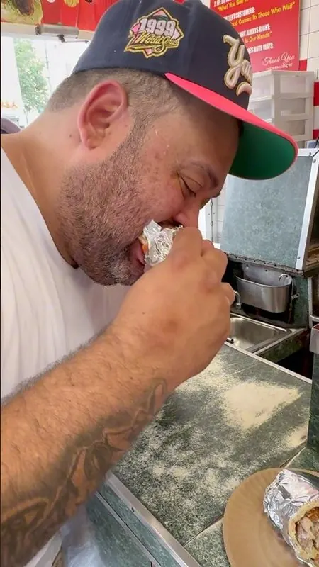 LegendarySwaG taking a bite of a gyro